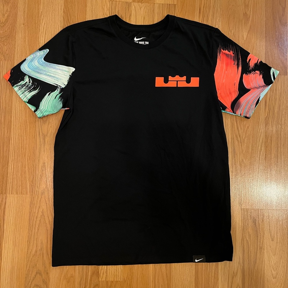 Nike athletic cut dri-fit black t-shirt with color design on sleeves